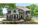 Two-story brick home with well-manicured lawn and lake views at 513 Viridian Vw, Peachtree City, GA 30269