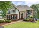 Two-story brick home with black shutters and inviting front entrance at 513 Viridian Vw, Peachtree City, GA 30269