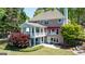 Brick home featuring a screened porch, patio, and landscaped yard, offering charm and outdoor living spaces at 513 Viridian Vw, Peachtree City, GA 30269