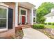 Elegant brick home featuring a bright red front door and white columns at 513 Viridian Vw, Peachtree City, GA 30269