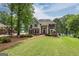 Beautiful brick home with a lush lawn and mature trees at 513 Viridian Vw, Peachtree City, GA 30269