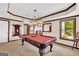 Game room features a pool table and a partial view of the bar area at 513 Viridian Vw, Peachtree City, GA 30269