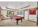 Game room with pool table, recessed lighting, wood trim, window and dart board wall decoration at 513 Viridian Vw, Peachtree City, GA 30269