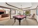 Game room with pool table, stylish pendant lighting, and an inviting view to a recreation area at 513 Viridian Vw, Peachtree City, GA 30269