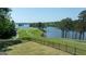 Picturesque waterfront golf course with lush greenery and scenic lake views for a luxurious living experience at 513 Viridian Vw, Peachtree City, GA 30269