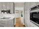 Well-lit kitchen features stainless steel appliances, white subway tile backsplash, and light gray cabinetry at 513 Viridian Vw, Peachtree City, GA 30269