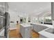 Open kitchen with gray cabinets, quartz countertops, stainless steel appliances and seamless access to living spaces at 513 Viridian Vw, Peachtree City, GA 30269