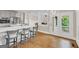 Open kitchen with a center island, hardwood floors, and views of the outdoor patio at 513 Viridian Vw, Peachtree City, GA 30269