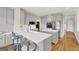 Modern kitchen with gray cabinets, center island, quartz countertops, and stainless steel appliances at 513 Viridian Vw, Peachtree City, GA 30269