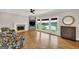 Bright living room boasts hardwood floors, a fireplace, and large windows with lake views at 513 Viridian Vw, Peachtree City, GA 30269