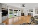 Open living space features hardwood floors, built-in shelves, and large windows with scenic views at 513 Viridian Vw, Peachtree City, GA 30269