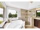 Main bathroom with soaking tub, glass shower, and beautiful view of the exterior at 513 Viridian Vw, Peachtree City, GA 30269