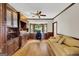 Home office with custom built-ins, hardwood floors, and a cozy seating area at 513 Viridian Vw, Peachtree City, GA 30269