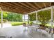 Enjoy the covered patio seating area and beautiful backyard views, ideal for outdoor gatherings and relaxation at 513 Viridian Vw, Peachtree City, GA 30269