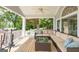 Relaxing porch featuring outdoor furniture, ceiling fan and nature views at 513 Viridian Vw, Peachtree City, GA 30269