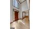 Inviting foyer with high ceilings, large windows, and hardwood floors, creating a bright and airy entrance at 2402 Creekside Trce, Jonesboro, GA 30236