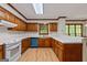 Spacious kitchen featuring ample counter space, wood cabinets, and a bright, functional layout at 2402 Creekside Trce, Jonesboro, GA 30236