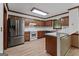 Well-equipped kitchen with stainless steel appliances, wood cabinetry, and a breakfast bar for casual dining at 2402 Creekside Trce, Jonesboro, GA 30236