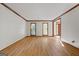 Bright living room has hardwood floors and views of entryway with windows at 2402 Creekside Trce, Jonesboro, GA 30236