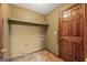 Practical mudroom with tile floors, shelving for storage, and a sturdy door for easy access at 2402 Creekside Trce, Jonesboro, GA 30236