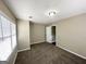 Cozy bedroom with carpet, natural light from windows, and a simple design at 1962 Marvin Sw Ln, Atlanta, GA 30311