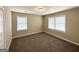 Inviting bedroom filled with light from two windows and featuring neutral carpet at 1962 Marvin Sw Ln, Atlanta, GA 30311