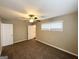 Bedroom with a ceiling fan, carpeted floor, and a door to the bathroom at 1962 Marvin Sw Ln, Atlanta, GA 30311