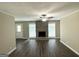 Spacious living room with a stone fireplace, ceiling fan, and durable floors at 1962 Marvin Sw Ln, Atlanta, GA 30311