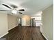 Open-concept living space featuring modern flooring, stainless steel appliances, and neutral paint at 1962 Marvin Sw Ln, Atlanta, GA 30311