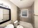Well-lit bathroom featuring modern fixtures and neutral tiling at 2965 Meadowview Se Dr, Atlanta, GA 30316