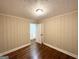 Comfortable bedroom with hardwood floors and a view of an open doorway to another room at 2965 Meadowview Se Dr, Atlanta, GA 30316