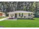Charming single-story home featuring a well-maintained lawn and complemented by mature trees at 2965 Meadowview Se Dr, Atlanta, GA 30316