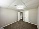 Cozy basement bedroom featuring neutral walls, carpeted floors, and two doors at 3798 Bakers Ferry Sw Rd, Atlanta, GA 30331