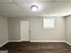 Finished basement bedroom with neutral walls, flooring and natural light from a window at 3798 Bakers Ferry Sw Rd, Atlanta, GA 30331