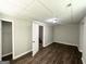 Finished basement bedroom with neutral walls and wood flooring. Provides room for living and leisure at 3798 Bakers Ferry Sw Rd, Atlanta, GA 30331