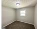 Bedroom featuring neutral carpet, a window for natural light, and grey walls at 3798 Bakers Ferry Sw Rd, Atlanta, GA 30331