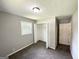 Bright bedroom with neutral walls, closet, and carpeted floors, providing comfort at 3798 Bakers Ferry Sw Rd, Atlanta, GA 30331