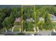 Aerial view of a wooded property lot featuring mature trees and nestled among luxury homes, providing a sense of privacy at 608 Wingspread, Peachtree City, GA 30269