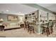 Cozy bar area with barstool seating, a comfortable sofa, and an open view to the kitchen at 608 Wingspread, Peachtree City, GA 30269