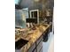 Luxurious bathroom featuring a granite countertop, dark cabinets, and a glass-enclosed shower at 608 Wingspread, Peachtree City, GA 30269