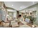 Spacious dining room featuring a large table, sitting area, and a view of the bar at 608 Wingspread, Peachtree City, GA 30269
