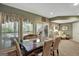 Elegant dining room with a large table, six chairs, and a view of the outdoor deck at 608 Wingspread, Peachtree City, GA 30269
