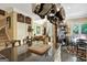 Open-concept kitchen with granite counters, an island, hanging pot rack, and dining area at 608 Wingspread, Peachtree City, GA 30269