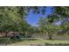 Lakeside view with lush greenery and trees at 608 Wingspread, Peachtree City, GA 30269