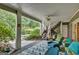 Covered patio with stairs leading to the backyard and pool with nice outdoor furniture at 608 Wingspread, Peachtree City, GA 30269