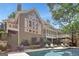 Back of house with a beautiful pool and patio, perfect for outdoor entertaining at 608 Wingspread, Peachtree City, GA 30269