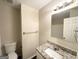 Bright bathroom featuring a granite vanity top, white cabinets, and neutral wall color at 3865 Lehigh Blvd, Decatur, GA 30034