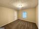Carpeted bedroom features a window providing natural light and a standard door at 3865 Lehigh Blvd, Decatur, GA 30034