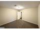 Neutral carpeted bedroom features standard lighting and white painted doors at 3865 Lehigh Blvd, Decatur, GA 30034