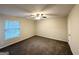 Bedroom with a ceiling fan and a window with blinds providing natural light at 3865 Lehigh Blvd, Decatur, GA 30034